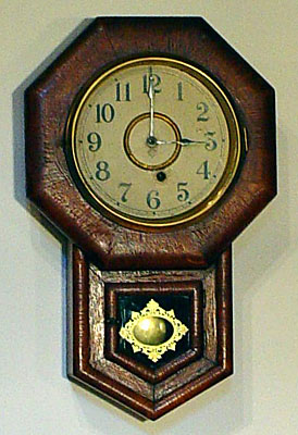 Oak miniature school clock made by the Ansonia Clock Company, Brooklyn, New York, circa 1885