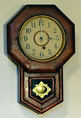 Oak miniature school clock made by the Ansonia Clock Company, Brooklyn, New York, circa 1885
